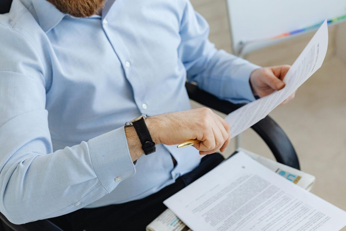 Man reviewing divorce legal documents in office